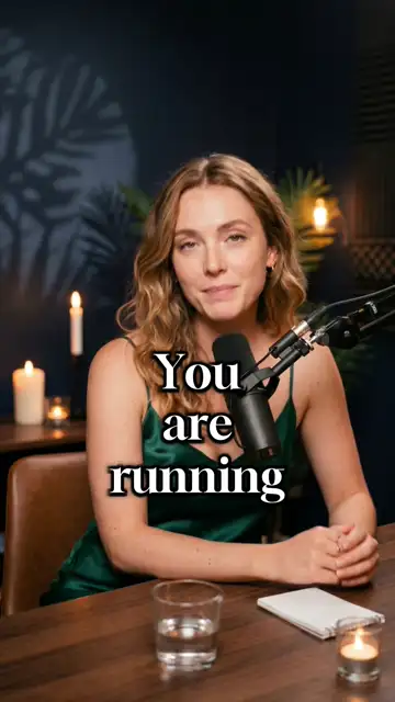 A presenter at a candle-lit podcast mic — a warm, high-production talking-head ad that offsets the cold dark page.